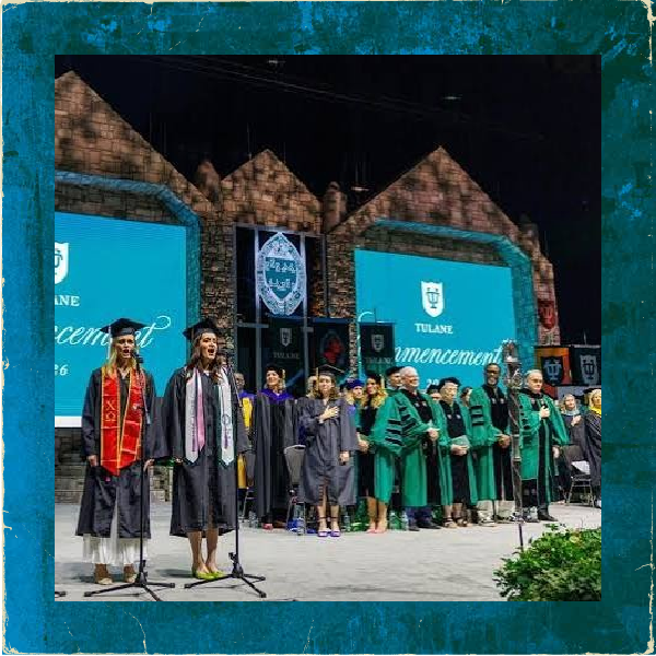 On stage at a Tulane commencement ceremony.